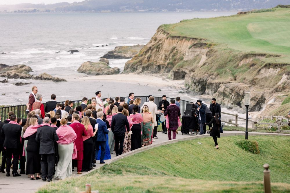 Wedding celebration overlooking dramatic coastal cliffs and ocean views.