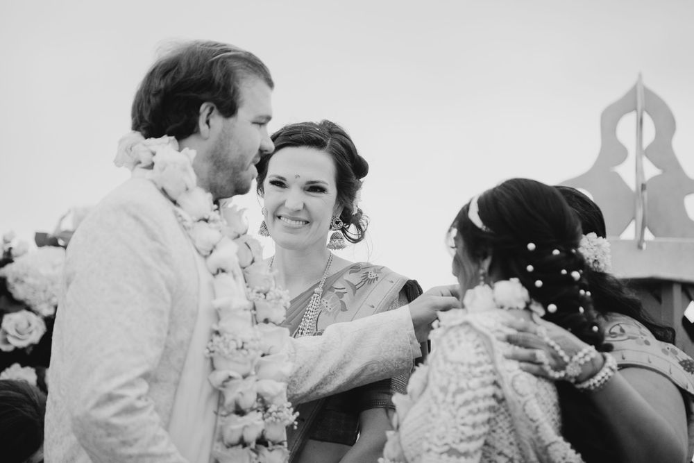 Wedding ceremony guests seated in a beautiful outdoor seaside venue.