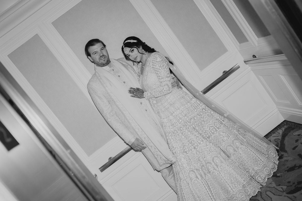 Black and white wedding portraits showing tender moments between the couple.