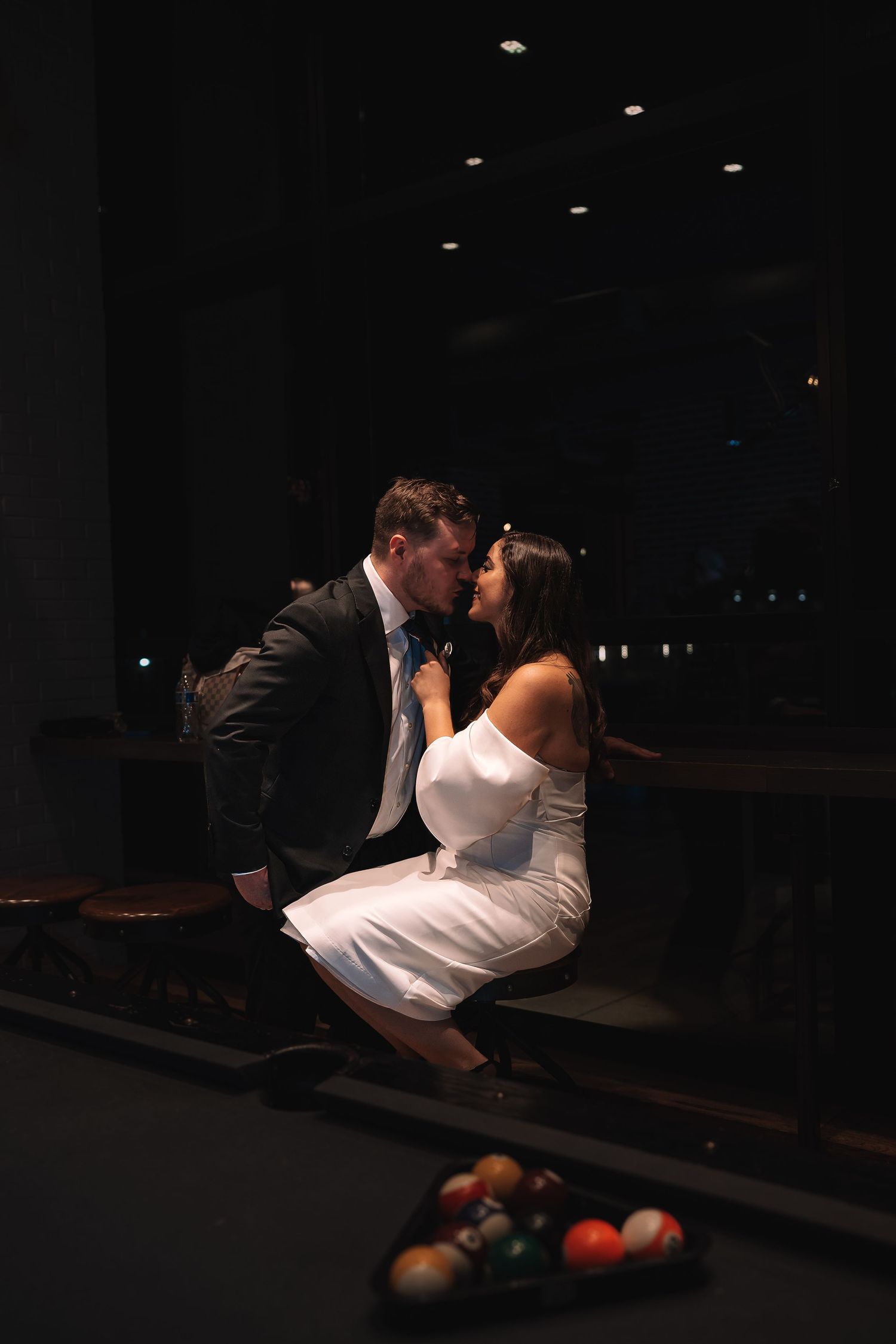 A newly engaged couple shows off their ring outside a historic building. Inside a historic DC building | Washington DC engagement photo.
