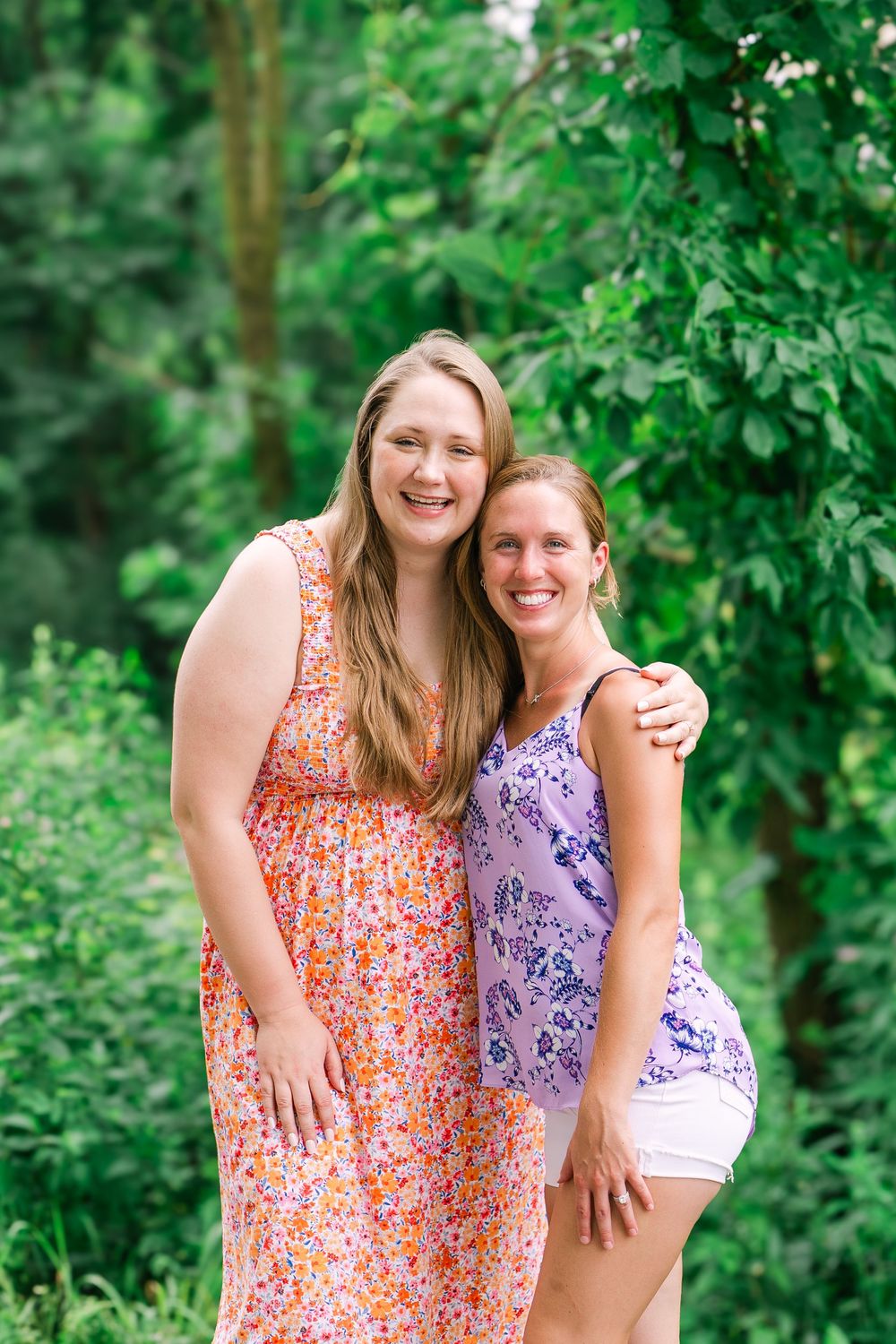 Bride-to-be smiling with friend at a picnic bachelorette in Victoria, Minnesota