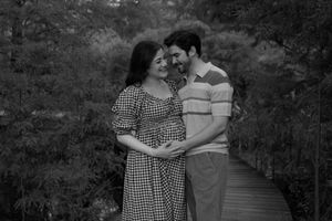 A romantic black and white portrait session along a garden path.