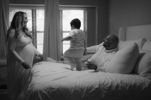 Black and white photos capturing tender moments in a sunlit bedroom.