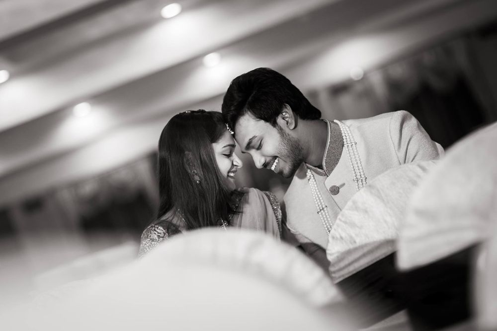 Black and white photo of an Indian couple during their wedding reception shot in a hotel