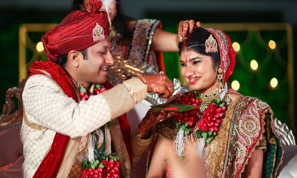 Groom applying sindoor on the bride’s forehead during a traditional Indian wedding ceremony in Wellington, New Zealand.