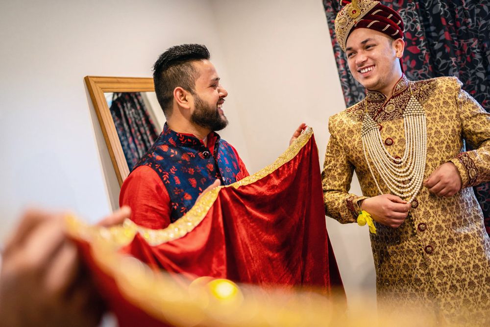 candid photo of nepali groom getting ready during wedding ceremony in lowerhutt