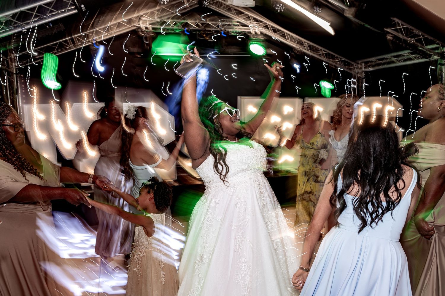 Capturing natural moments on the dance floor at a wedding.