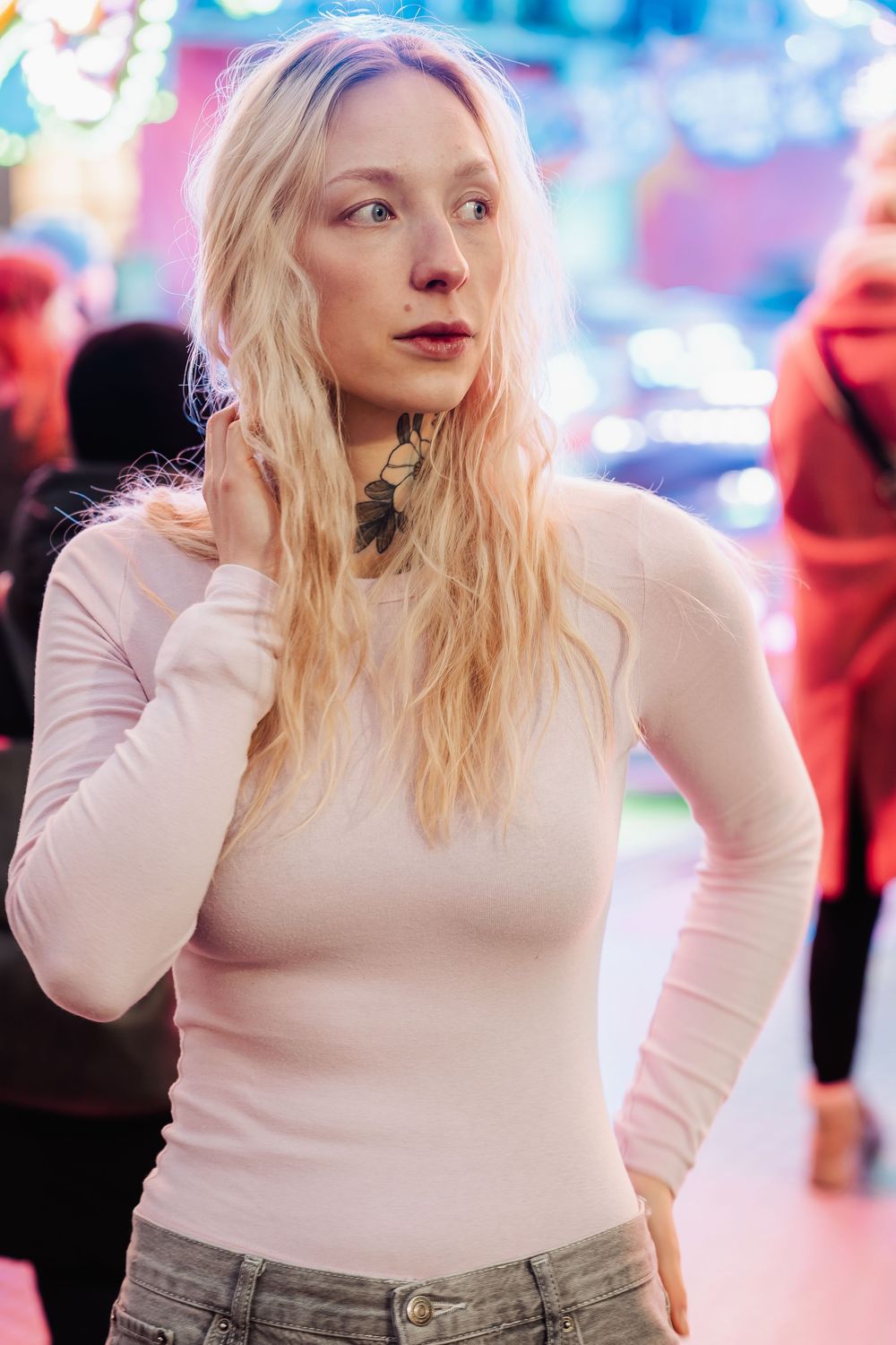 Dreamy portrait series with ethereal pink and blue lighting in an urban setting.