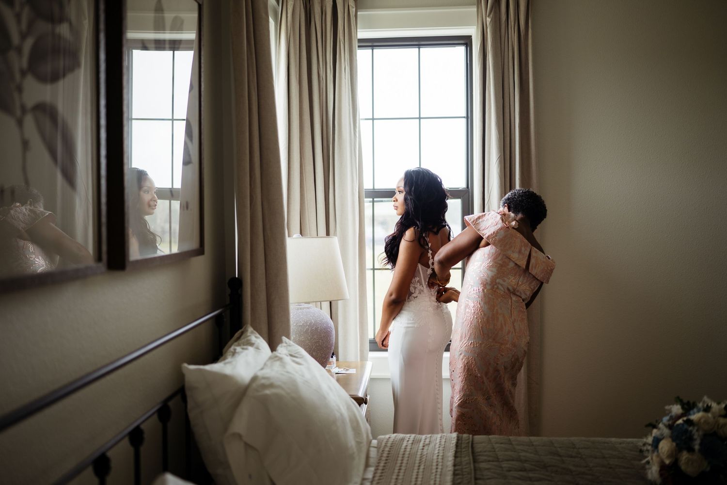 Light streams through curtained windows in a room with soft, muted tones.