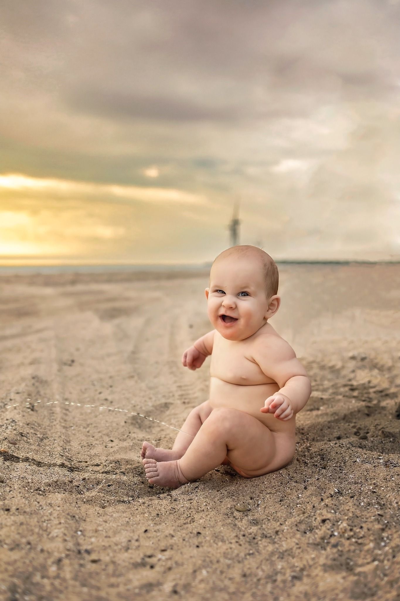 Sunset beach photography with golden sky and sandy backdrop.