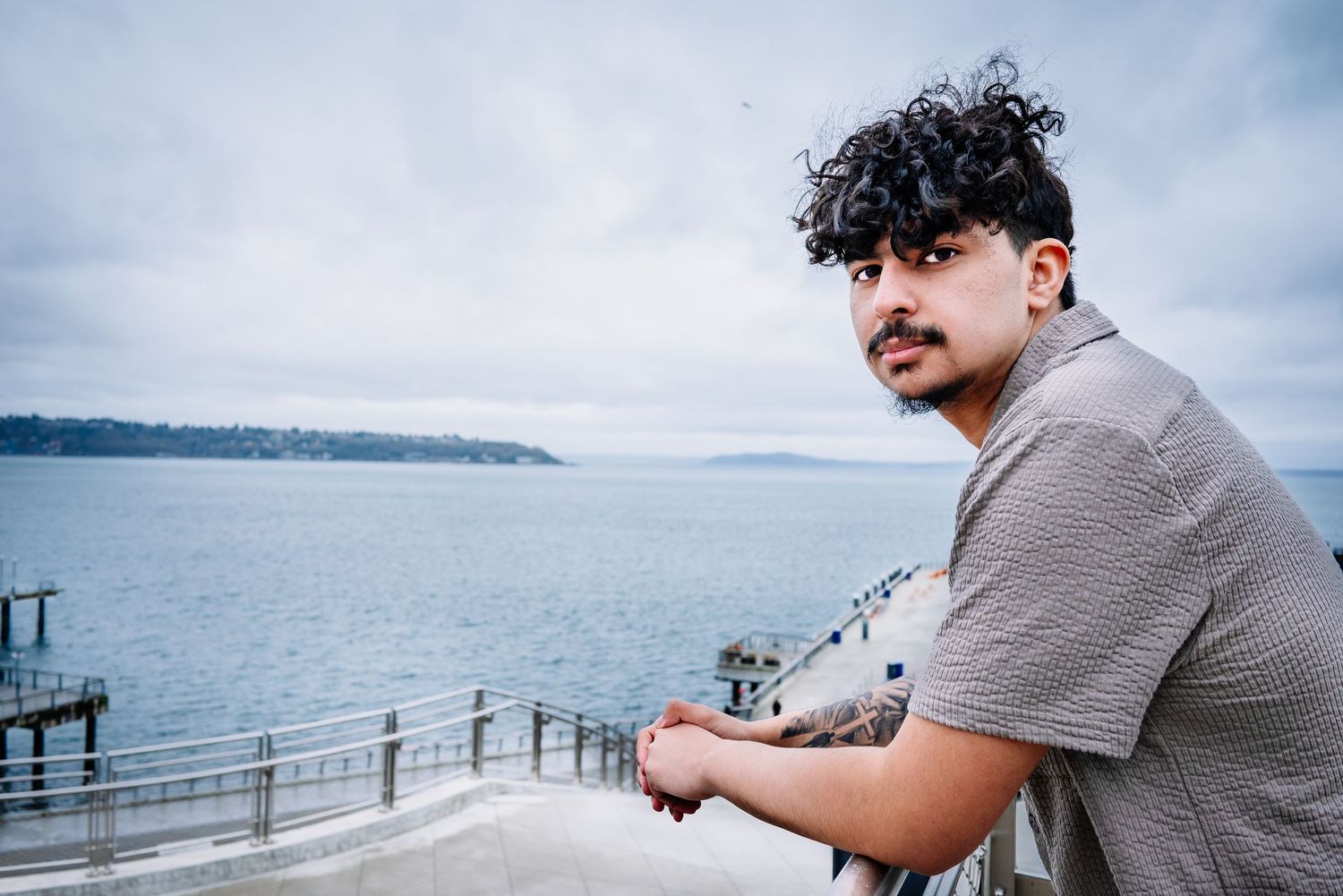 Senior graduation portrait overlooking Puget Sound from Seattle waterfront