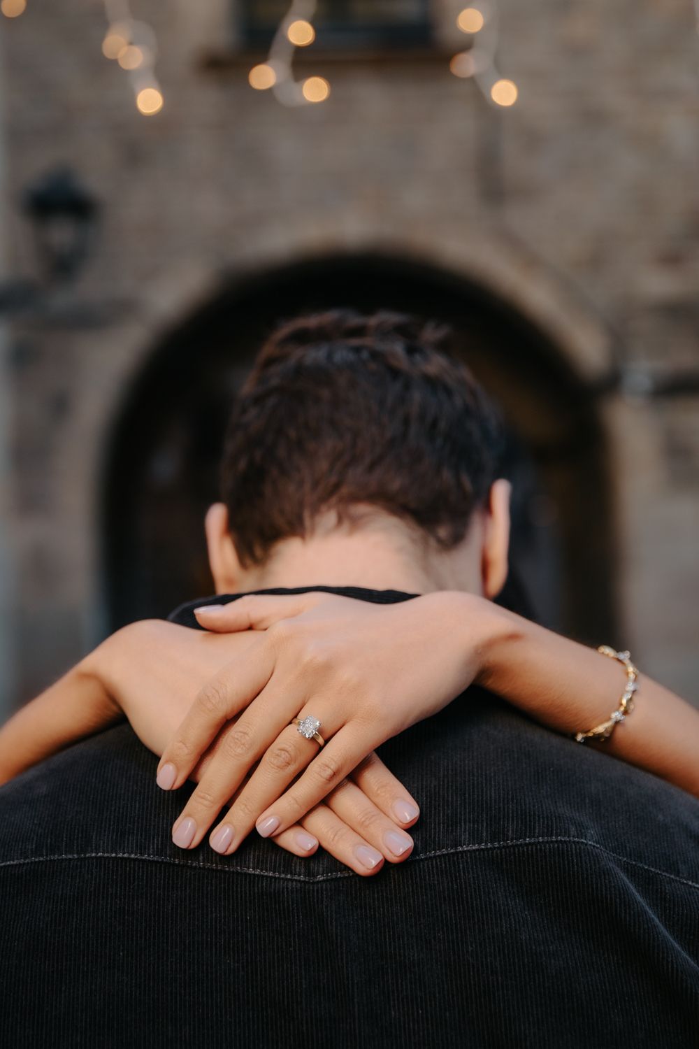 Soft kiss under cathedral façade Barcelona engagement session BarcelonaLoversPH
