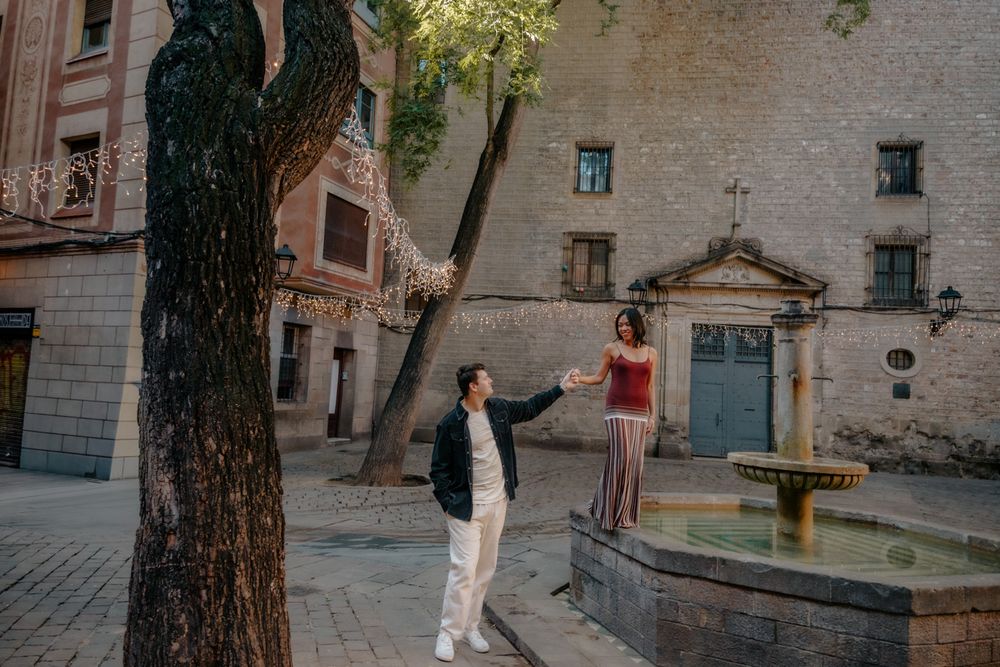 Joyful hug outside Barcelona Cathedral Engagement photoshoot Barcelona BarcelonaLoversPH
