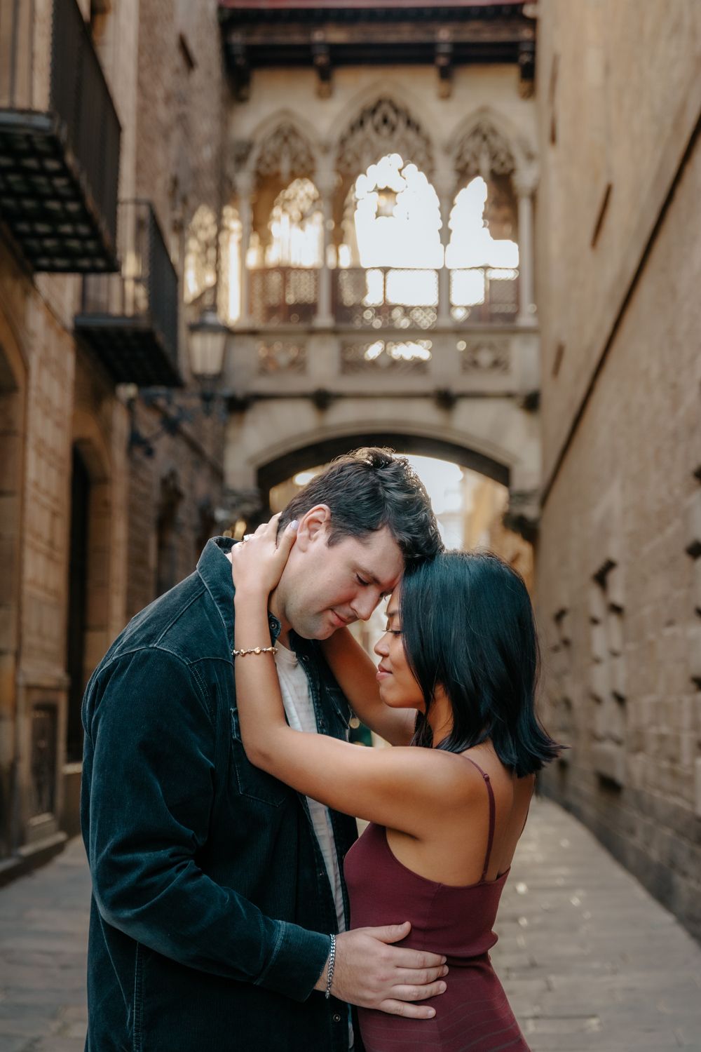 Walking hand in hand Gothic Quarter narrow street Engagement photoshoot Barcelona BarcelonaLoversPH