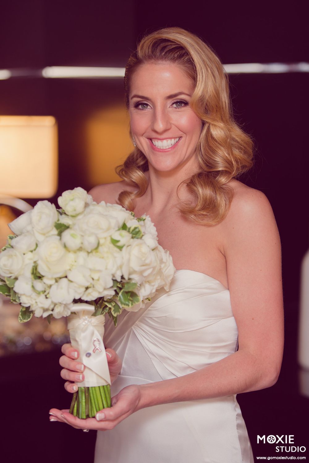 A series of wedding photos showing a bride holding a white rose bouquet in a strapless dress.