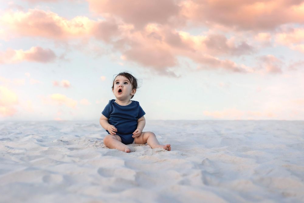 Fine art baby portrait photography with soft sunset tones and natural light