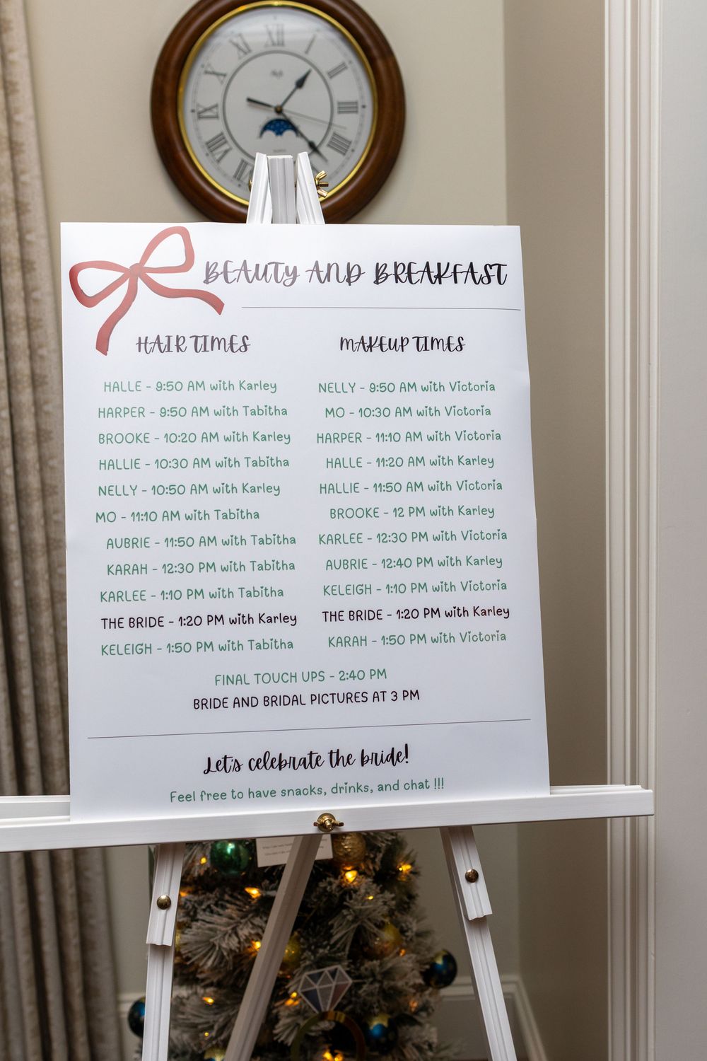 Wedding timeline schedule displayed on white boards with clocks mounted on wall showing various appointment times for beauty services.
