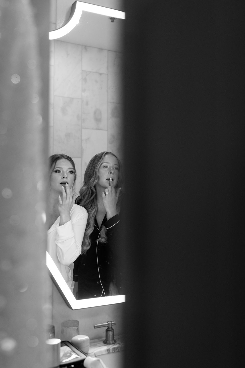 Moody reflections in mirror with dramatic lighting and dark shadows.