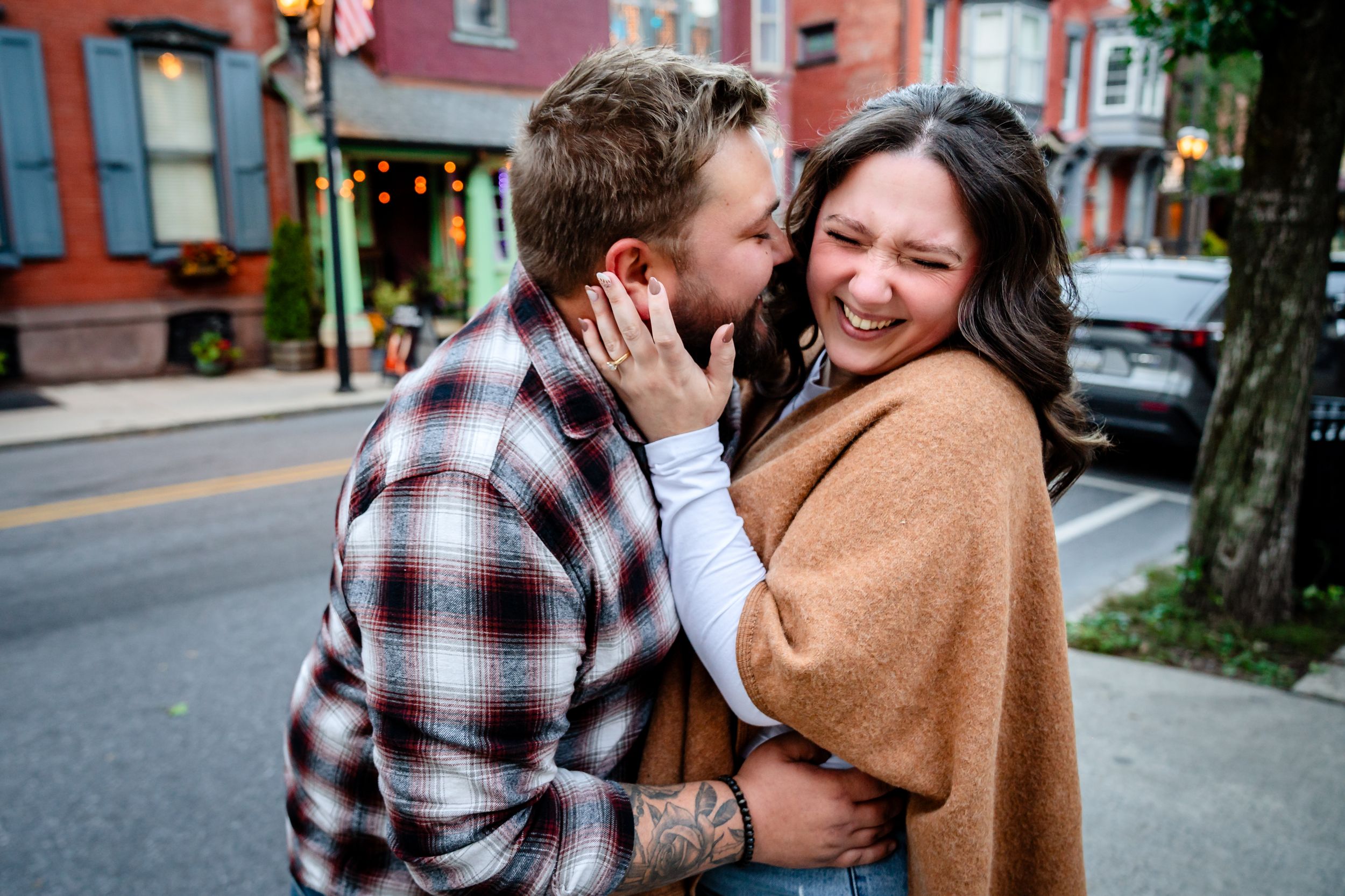 Candid moments captured on a city street with historic buildings in background.