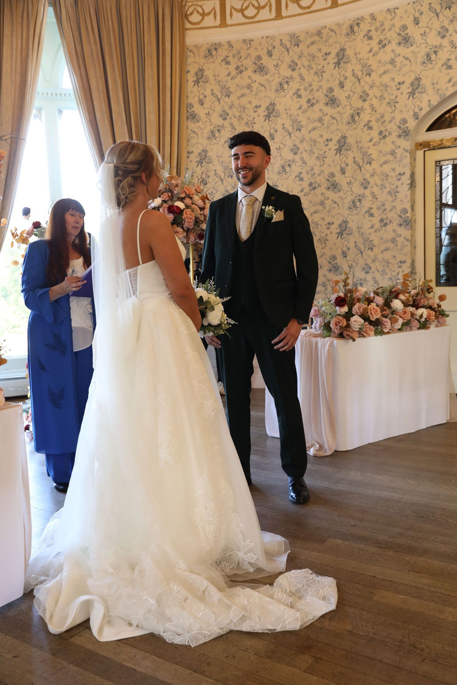 A series of wedding reception photos showing a bride in a white gown dancing with guests on a hardwood floor.