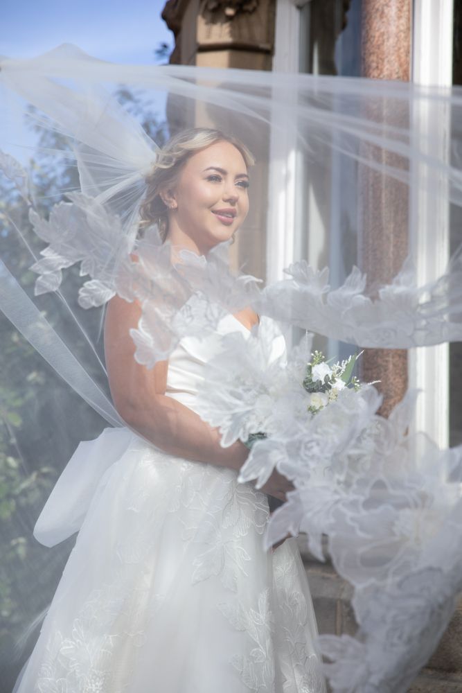 Ethereal wedding veil billows gracefully around a white bridal gown in multiple artistic shots.