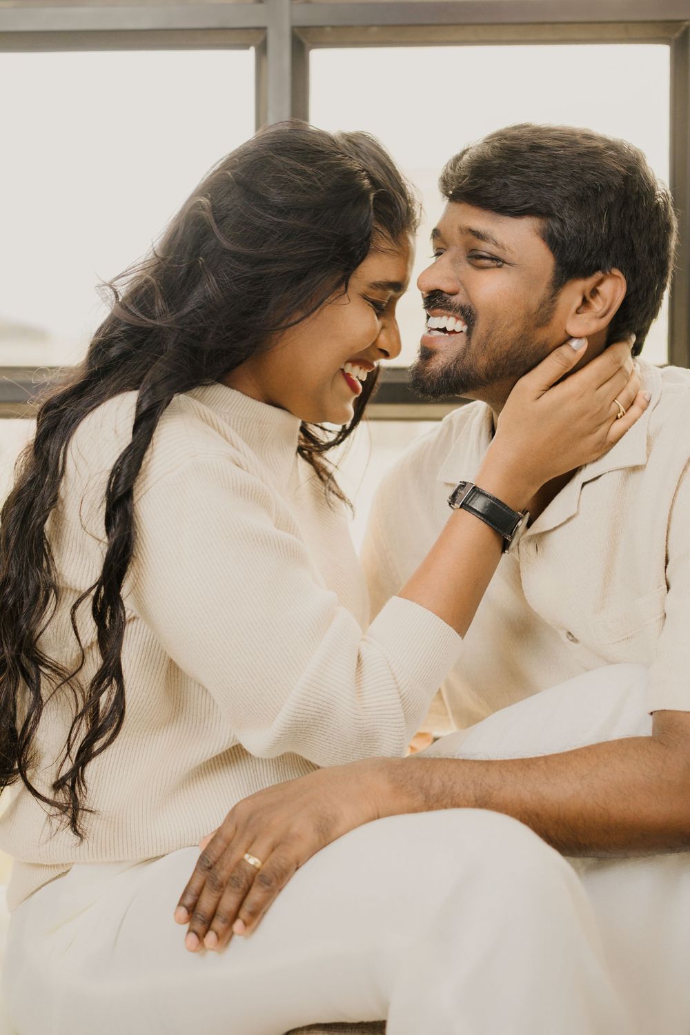 A romantic couple in white outfits share tender moments in a sequence of intimate photos.