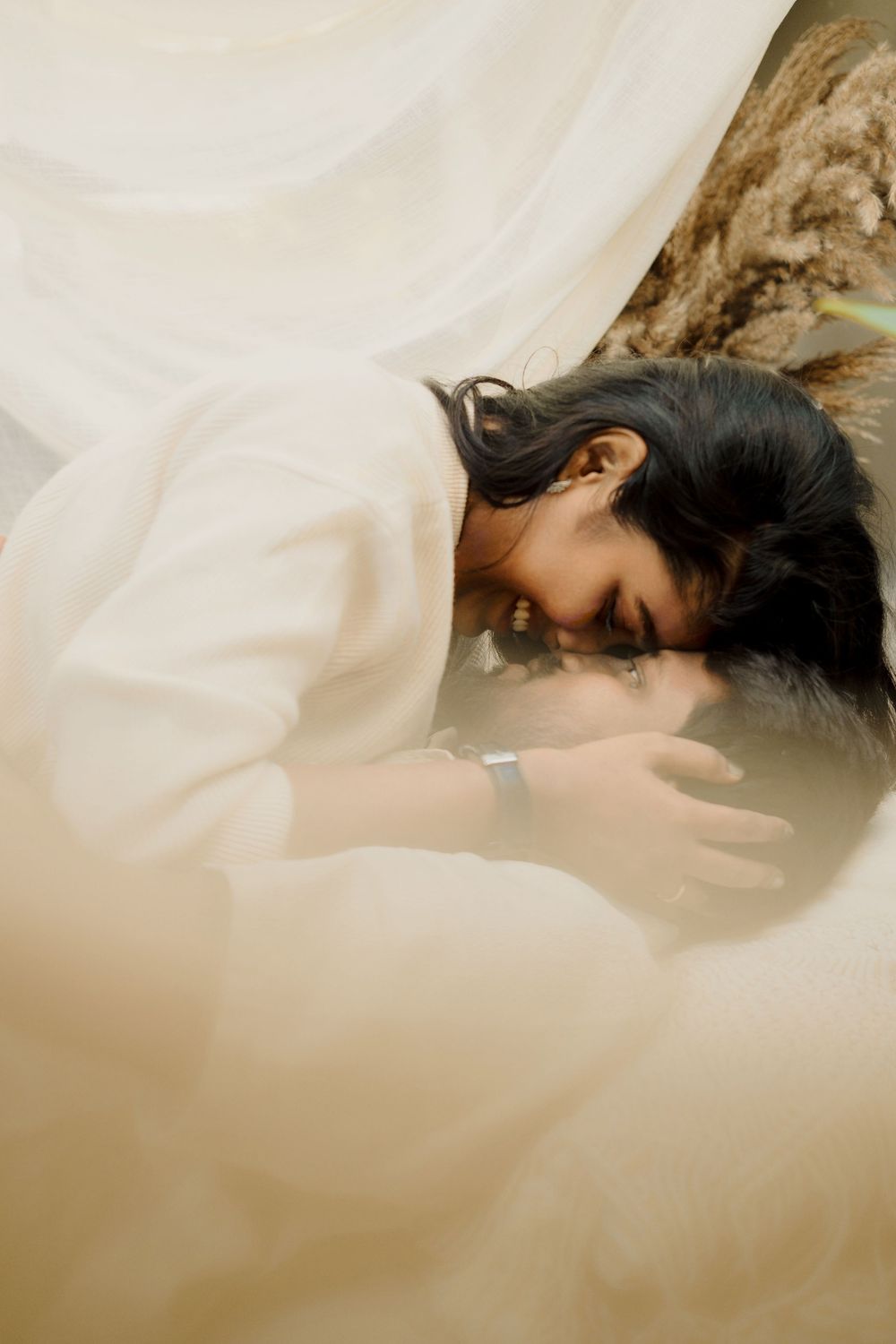 Dreamy artistic portrait with soft focus and ethereal lighting creating a romantic mood.