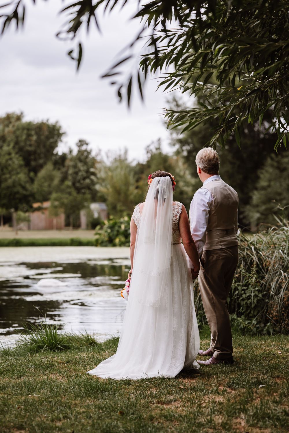 Bride and Groom at the Waterside Country Barn and Mill lakeside wedding venue near Taunton, Somerset. Relaxed Somerset Wedding photographer