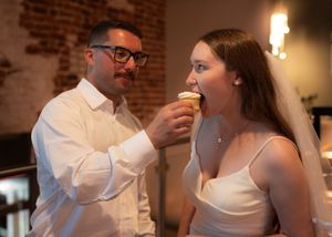 Romantic candlelit moment during an evening wedding reception.