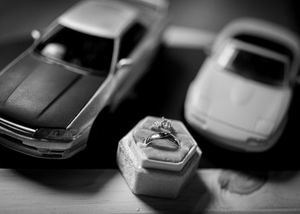Artistic black and white detail shot of miniature toy cars.