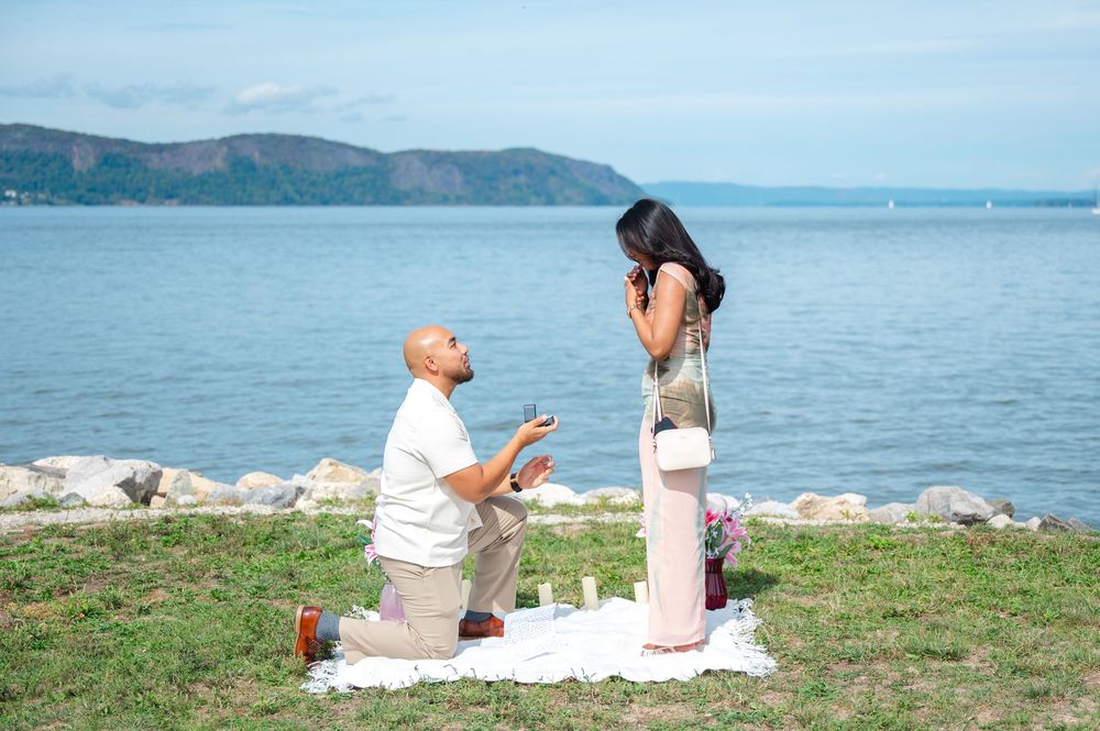 A romantic proposal scene unfolds along the Hudson River in Sleepy Hollow in Westchester, NY. Captured by Joliette Marie Photography.