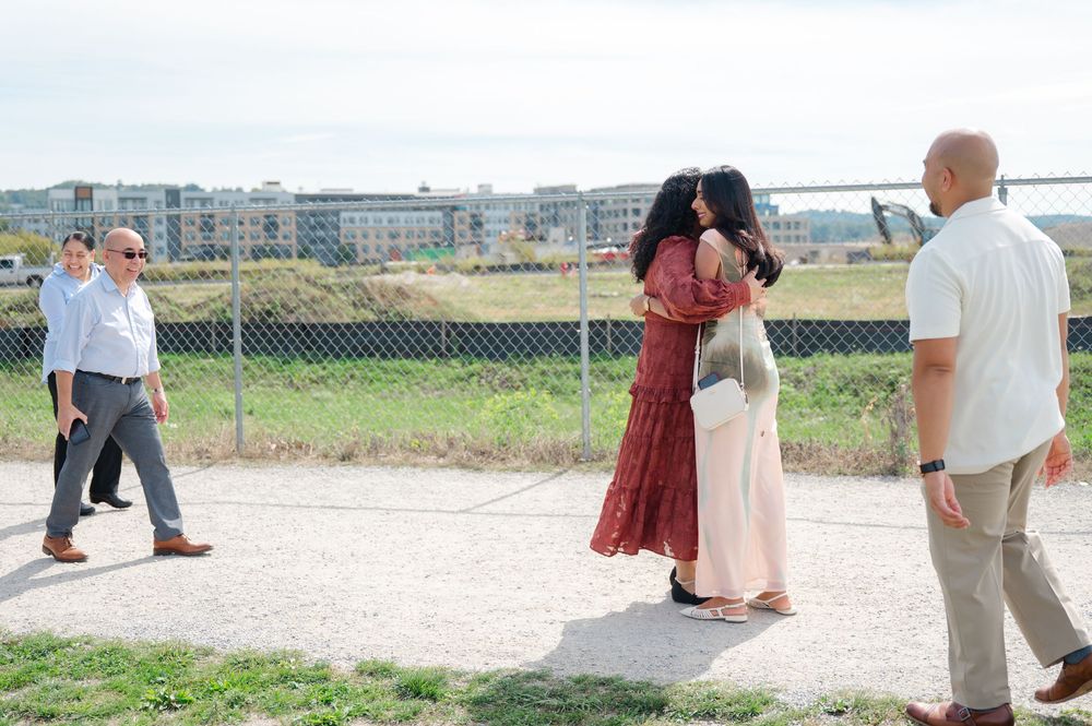 A family congratulates a newly engaged couple on their proposal in Tarrytown, NY.