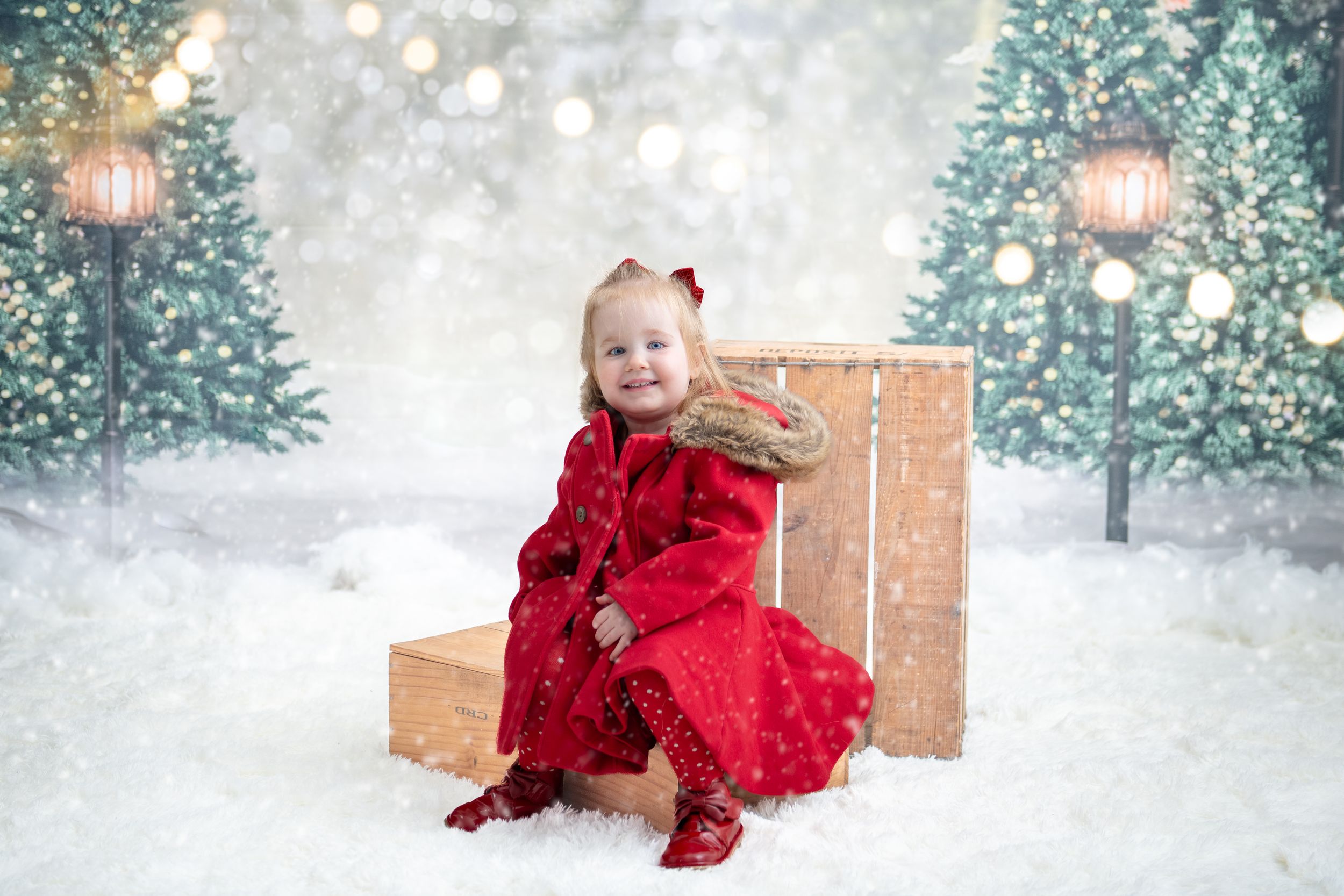 A series of winter snow photos featuring someone in a red dress against a snowy backdrop with evergreen trees.