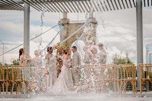 Toasts and laughter fill the air during a Cincinnati wedding reception at Anderson Pavilion.