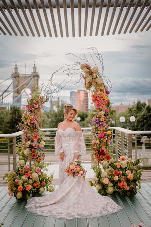 Bride with dress from @reneegrace_bridal with the Ohio River in the background at Anderson Pavilion.