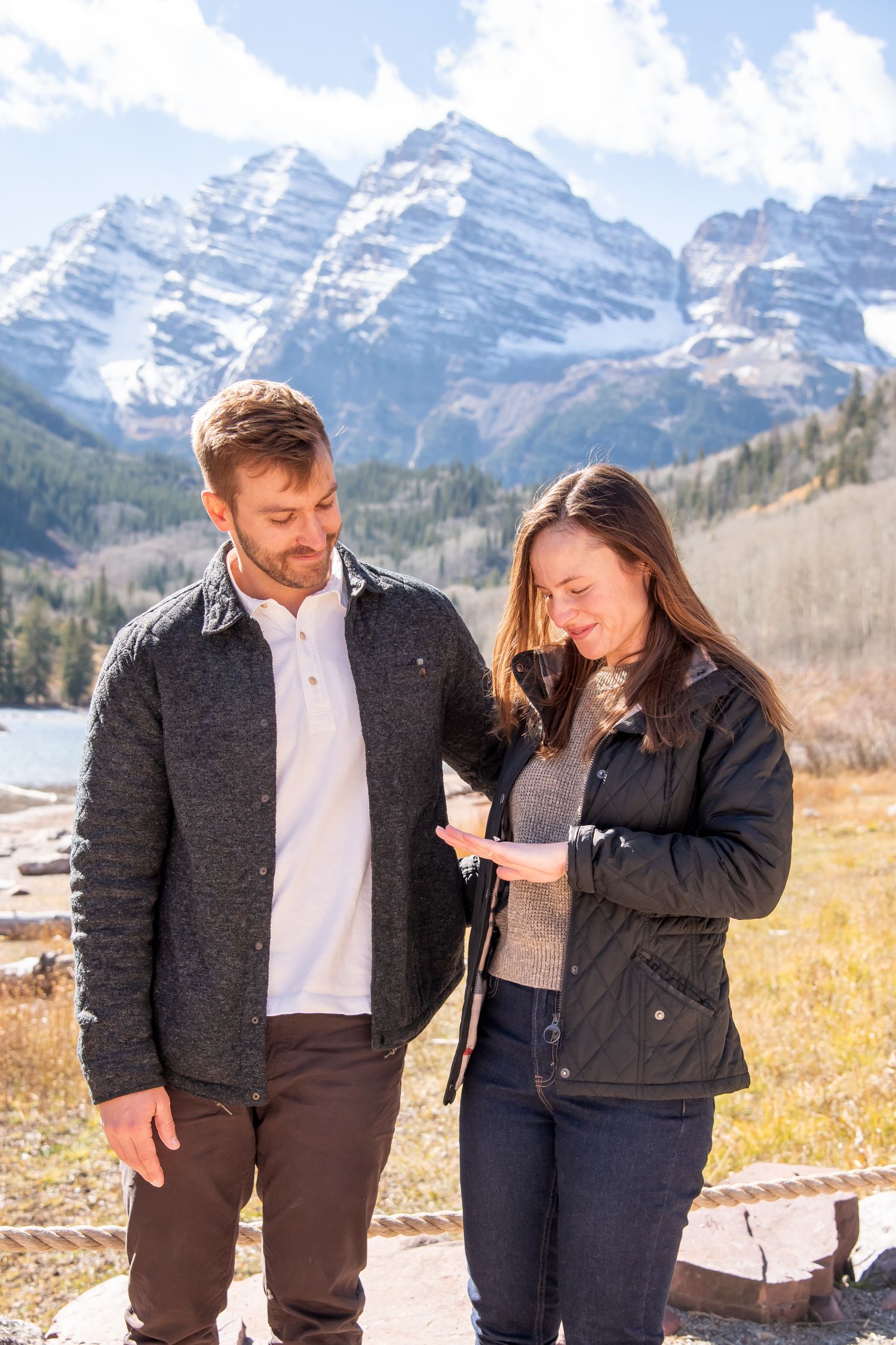 A happy couple after a spurs proposal at The Maroon Bells in Aspen Colorado