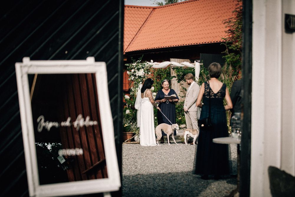 A series of polaroid-style wedding photos displayed against a dark background with warm lighting.