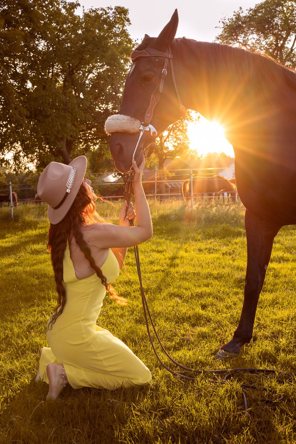 A sequence of playful swings at sunset shows a person in a yellow dress enjoying a warm summer evening in a grassy field.