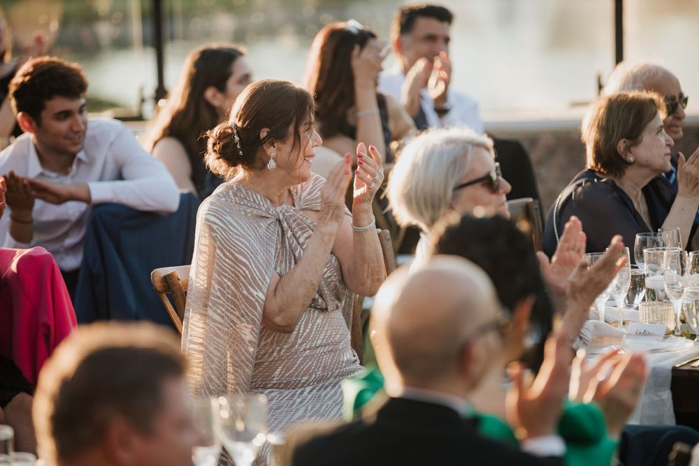mother of the groom applauding candidly