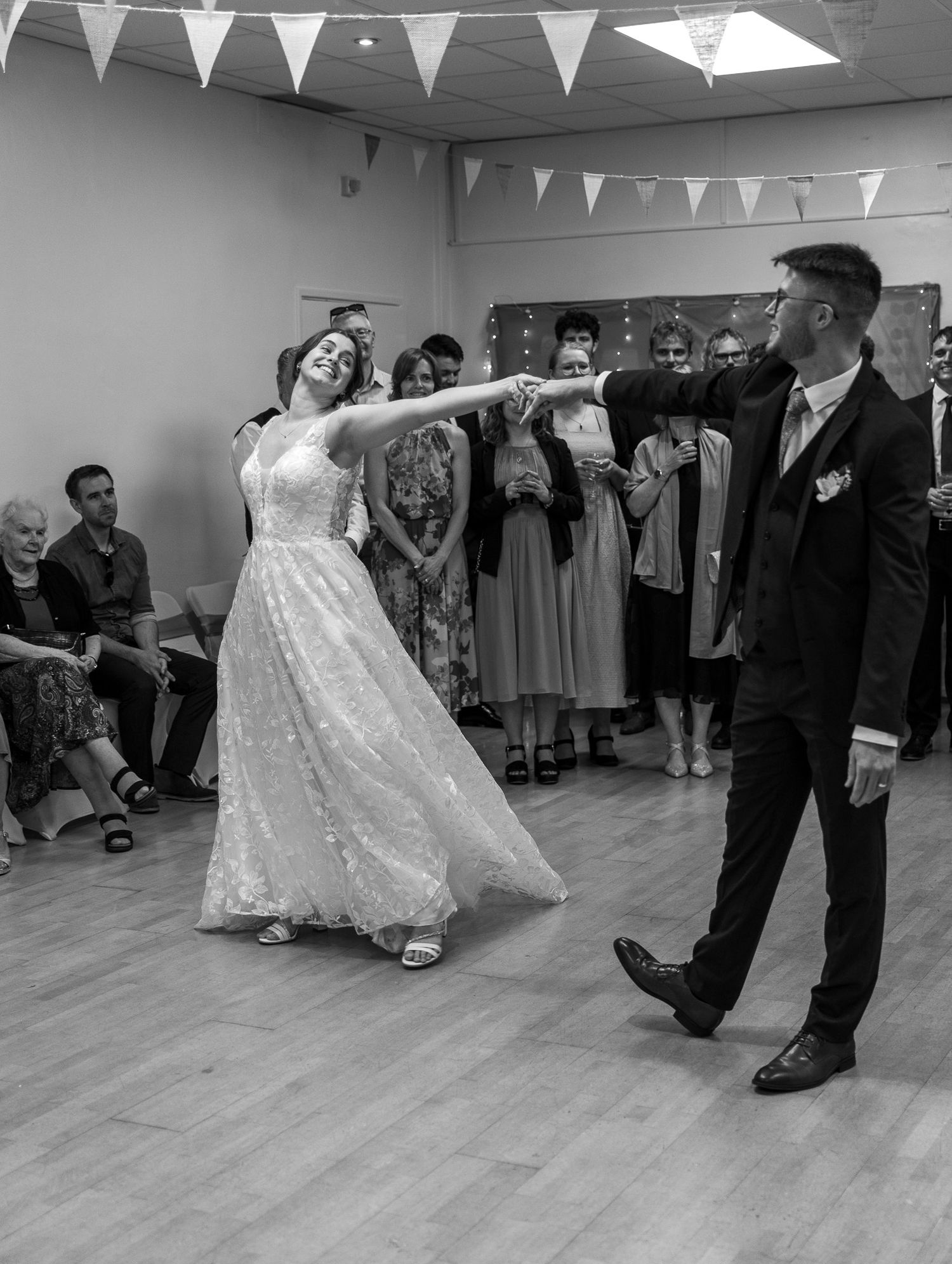 A sequence of dance moves at a wedding reception showing the bride and groom performing a choreographed routine.