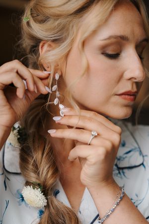 Close-up fashion shots showcase delicate silver jewelry and soft makeup styling in a romantic editorial series.