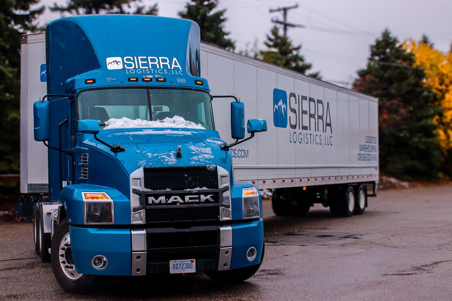 Commercial branding photo of a blue semi truck for a Michigan base to logistics company