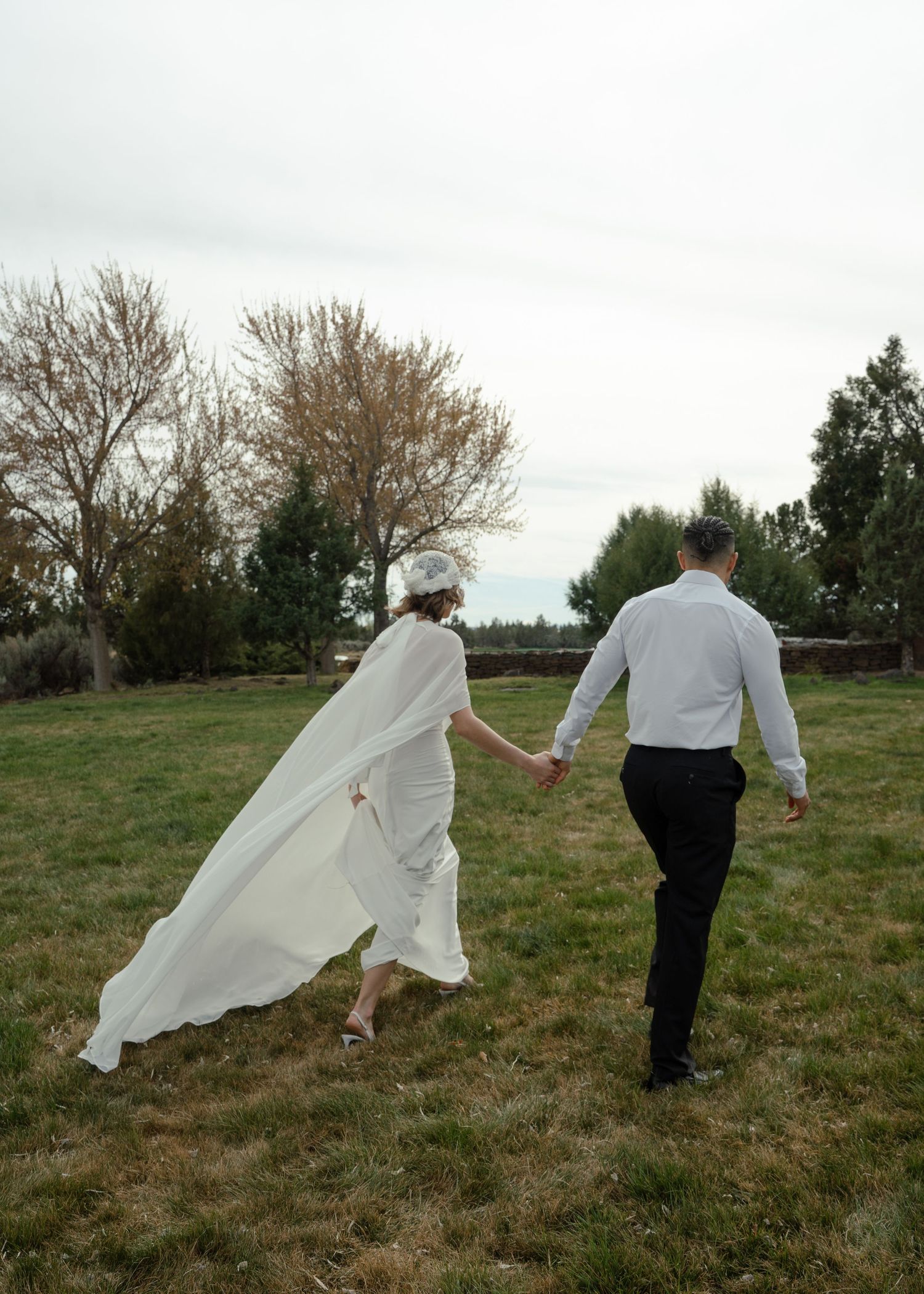 Two hands holding opposite ends of a red string against a green grassy background in a sequence of connected photos.