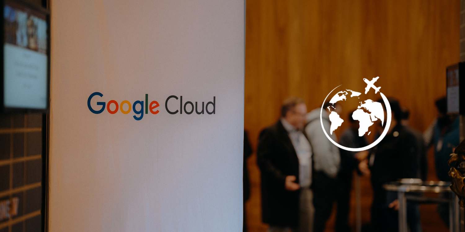 Google Cloud logo displayed at a business event with people networking in the background.