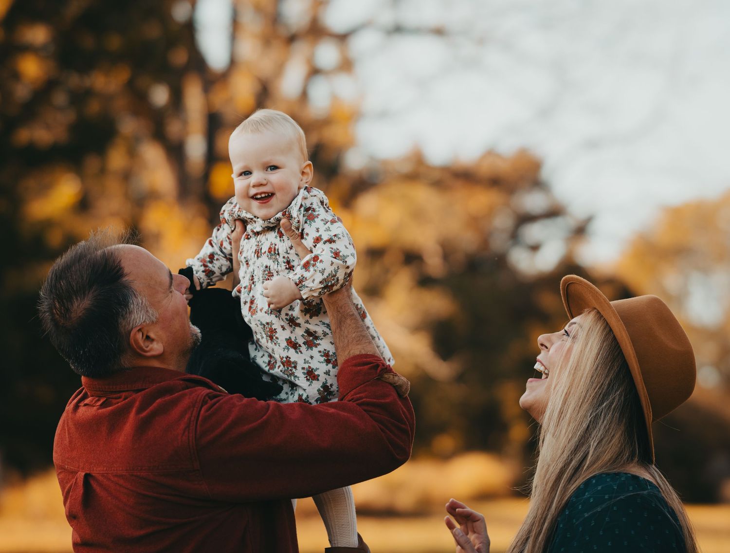 A series of joyful outdoor family moments captured during golden autumn hours with warm fall colors in the background.