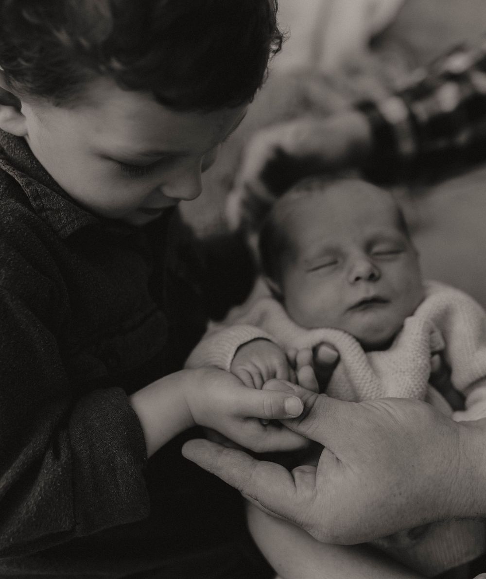 Newborn photoshoot capturing sweet, fleeting moments.