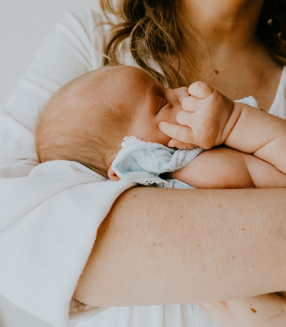 Newborn photoshoot capturing sweet, fleeting moments.