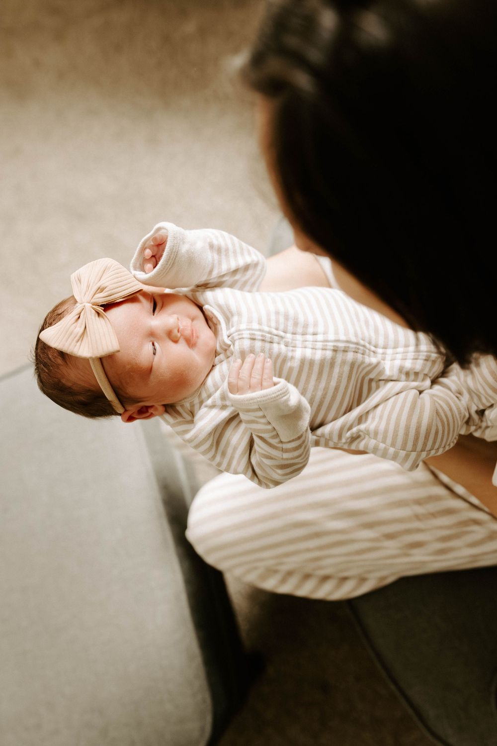 Newborn photoshoot capturing sweet, fleeting moments.