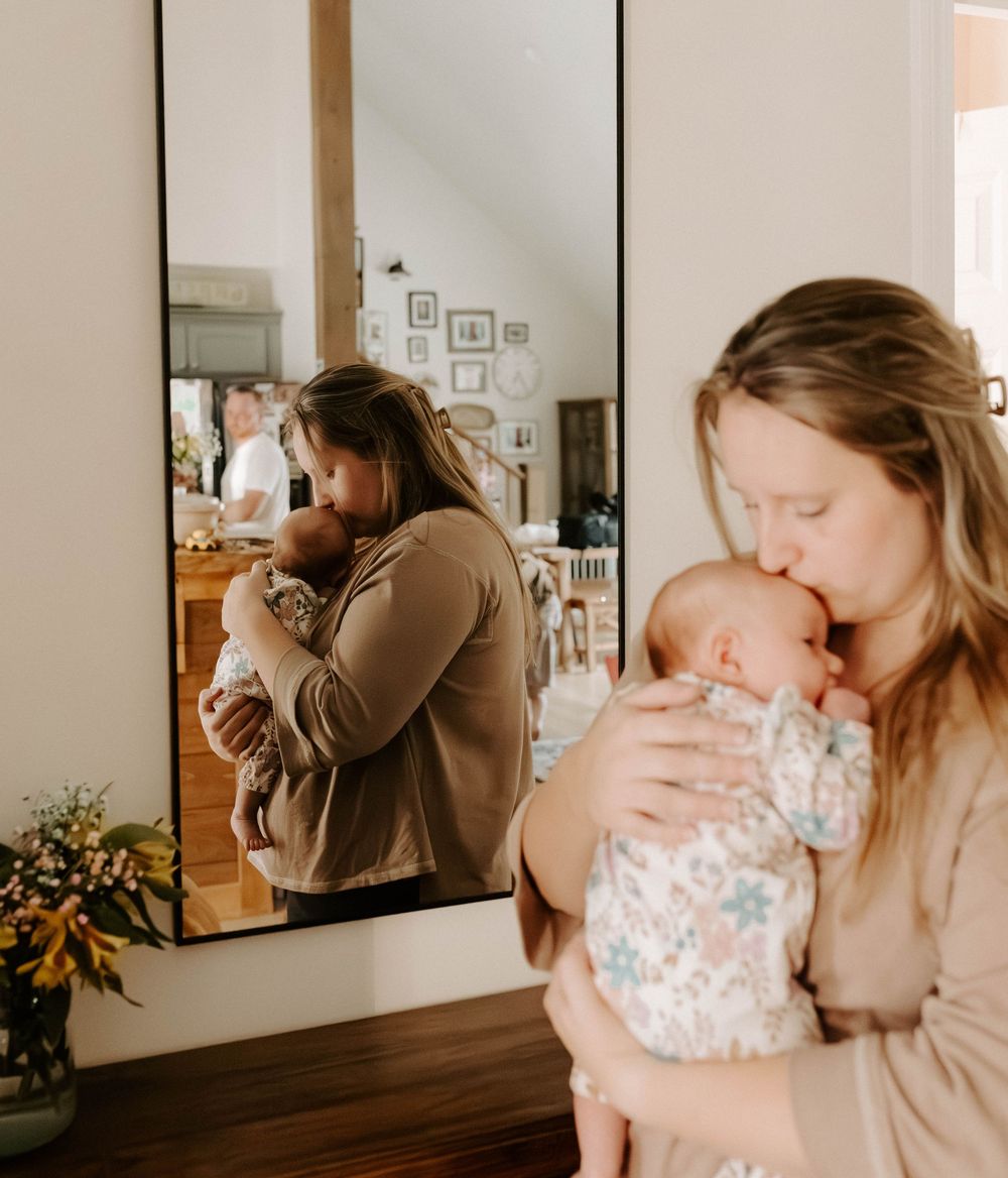 Newborn photoshoot capturing sweet, fleeting moments.