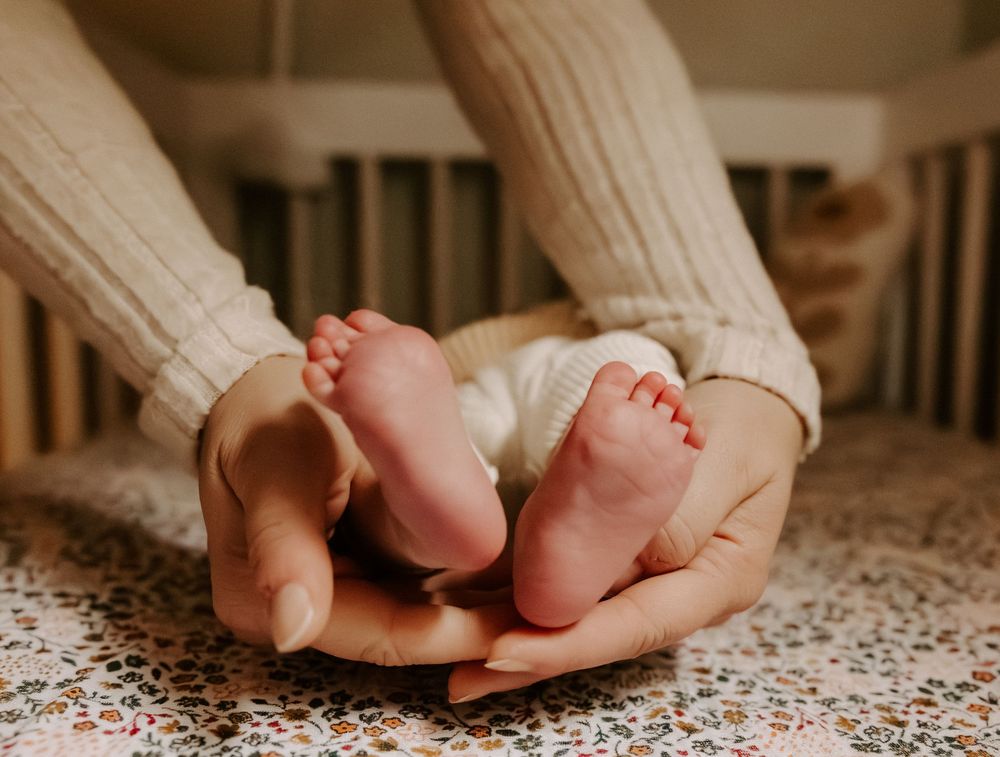 Newborn photoshoot capturing sweet, fleeting moments.